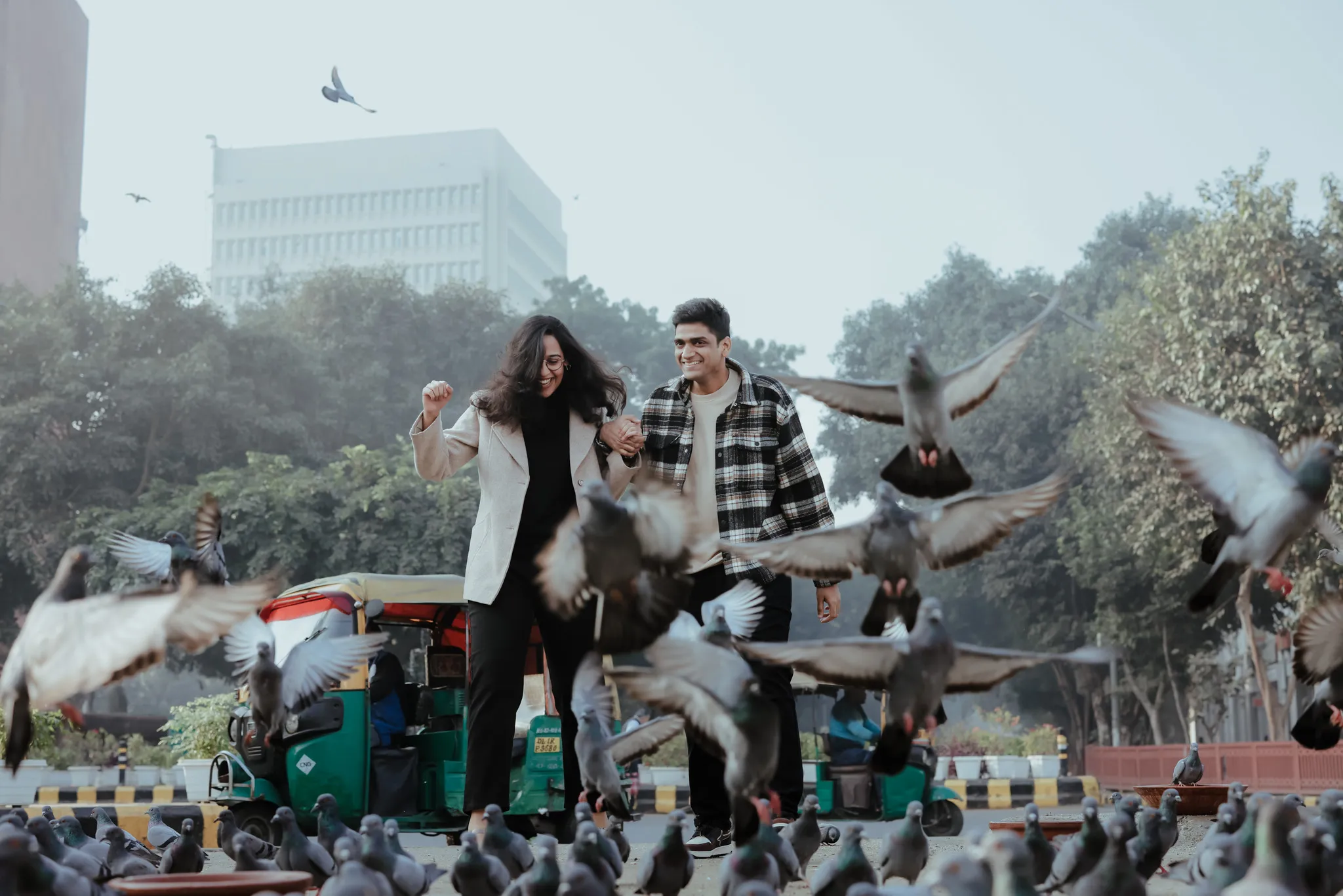 Pre wedding shoot couple having fun with nature birds flying with joy